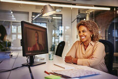 woman smiling at computer