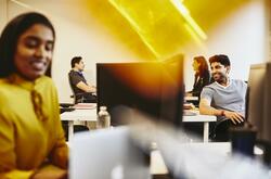 Men and women working in an office