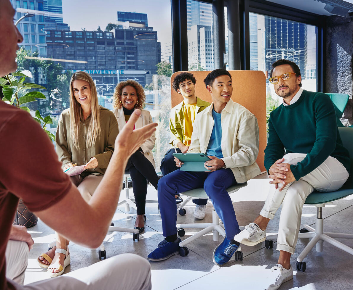 a group of employees at a seminar at work