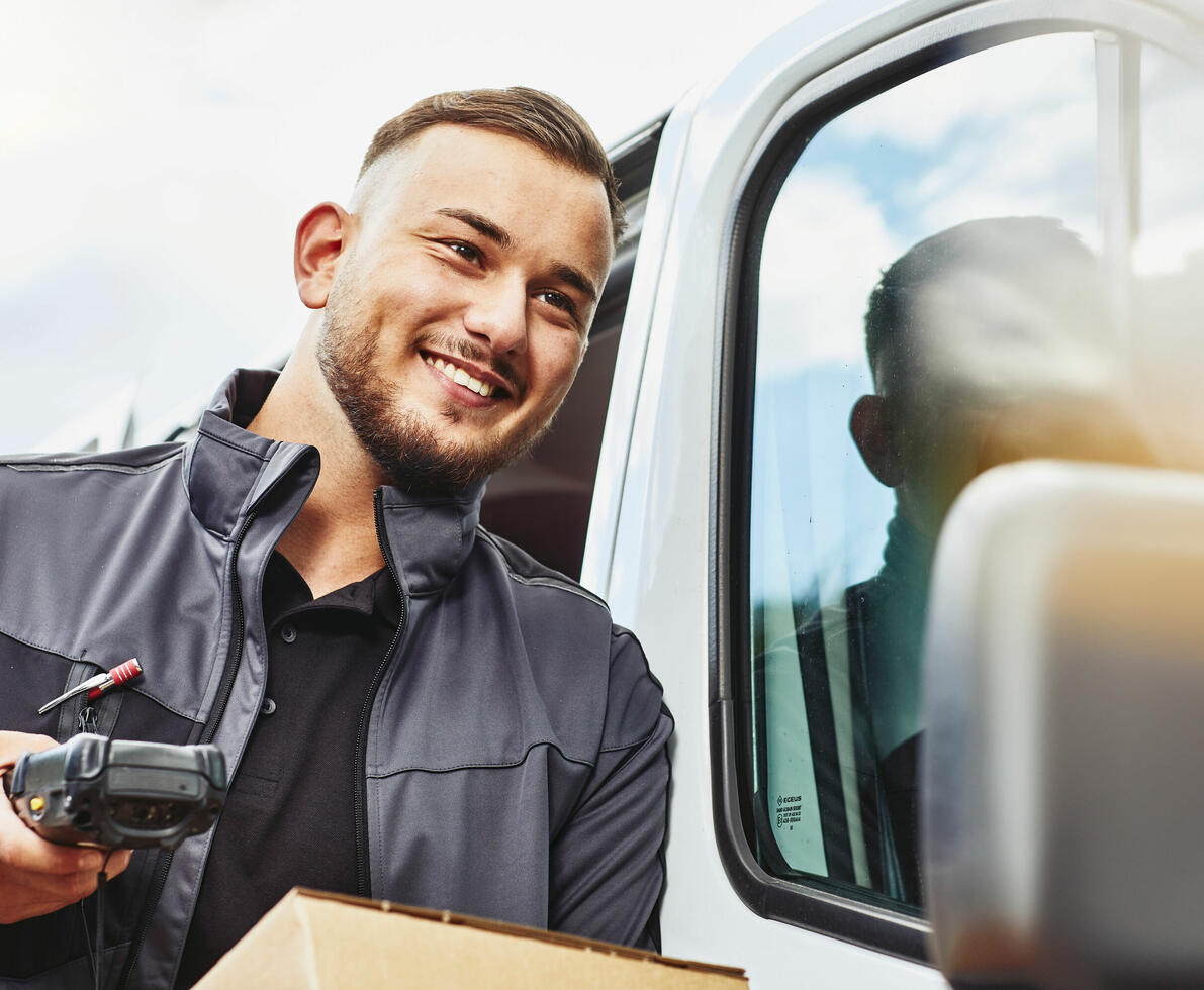a man working by a car 