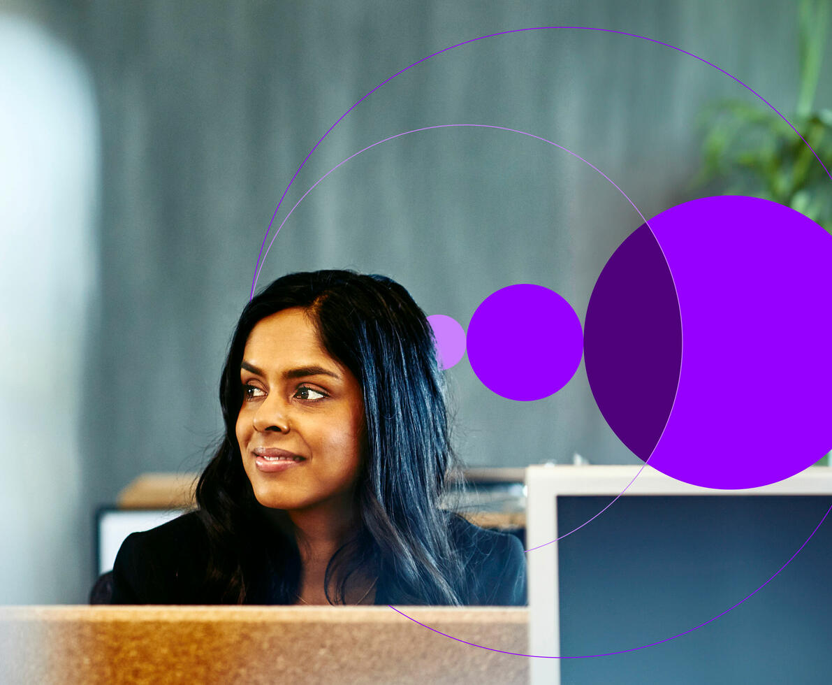 A smiling woman in an office cabin
