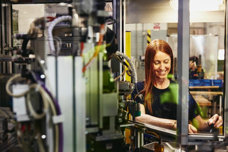 A woman working on a machine