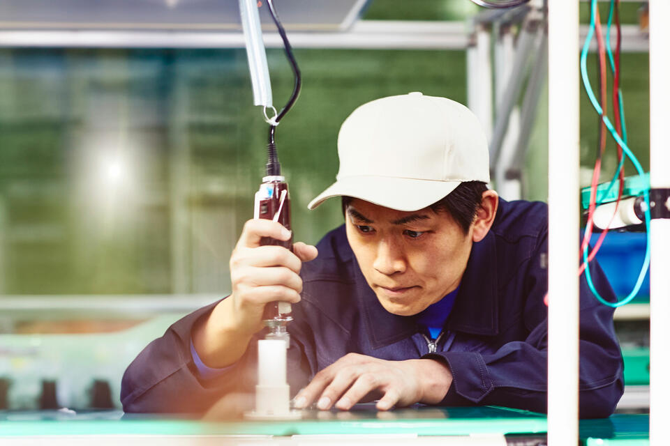 A man working with a tool